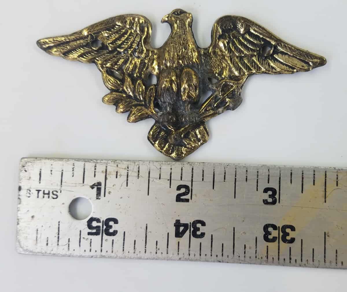 Eagle emblem brass - Hangar 19 Prop Rentals